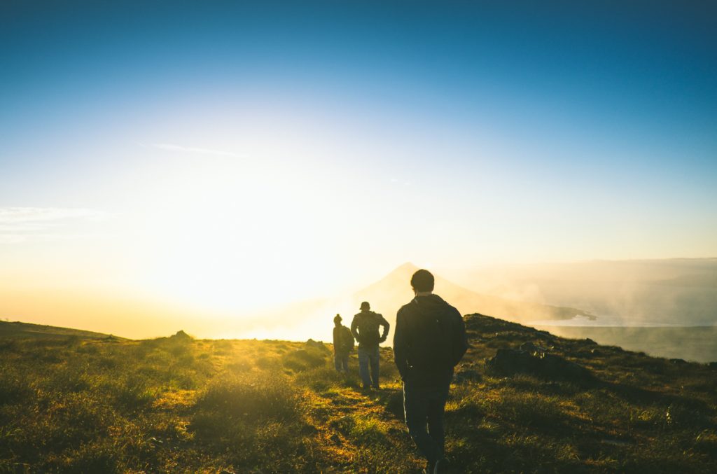 3 hikers on a mountaintop